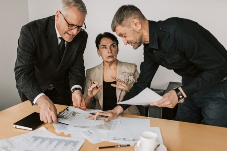 Executives in a corporate strategy meeting weighing a certification decision